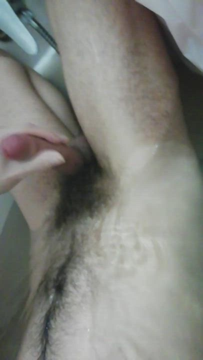 Cumming over my hairy belly on the bathtub