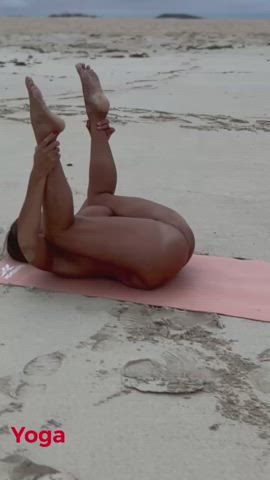 Naked Ebony MILF doing yoga on the beach