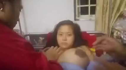 Forced lactation of busty Asian woman