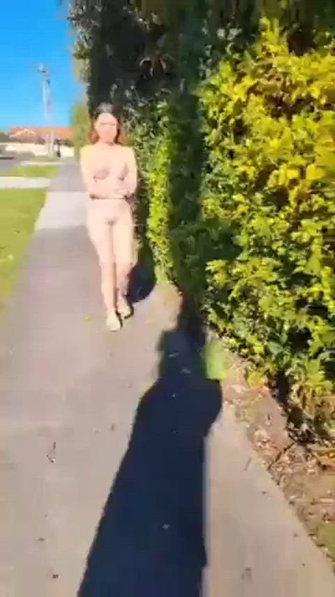 Naked woman walking down street