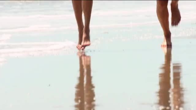 Kelly Rohrbach - Baywatch - running on beach in lifeguard bikini, with other lifeguards,