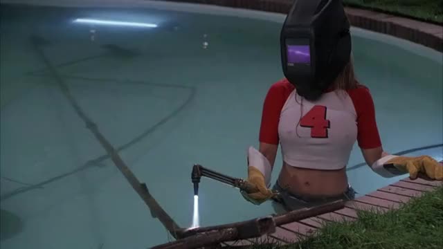 Carmen Electra - My Boss's Daughter - welding scene in pool, in tight t-shirt (pokies)