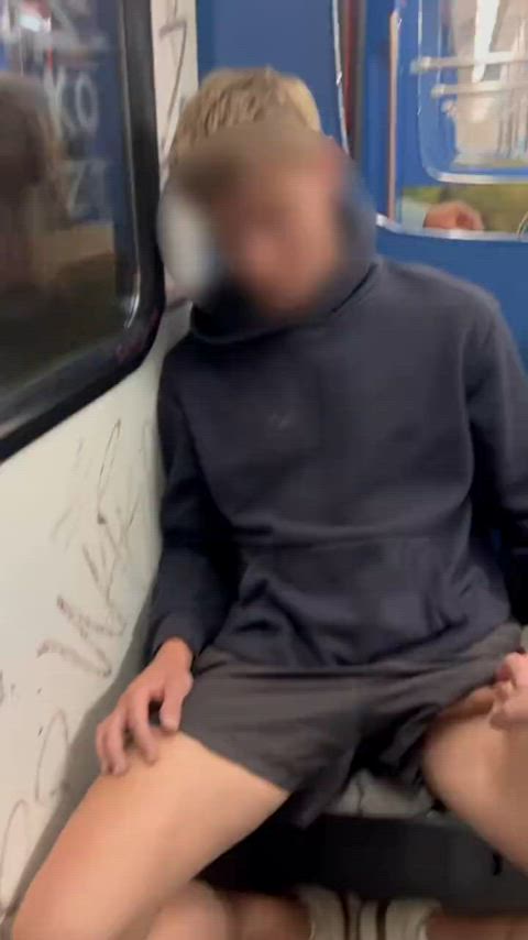 Horny twink gets a handjob on a public train and shoots all over himself.