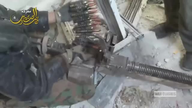 Syrian Rebel shoots a shoulder mounted DShK uncomfortably close to his buddies
