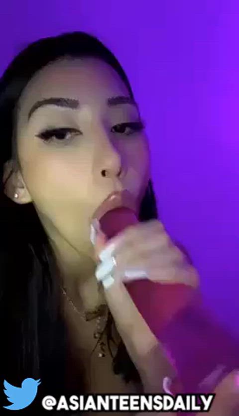 Cute asian teen camgirl sucking on dildo and moaning