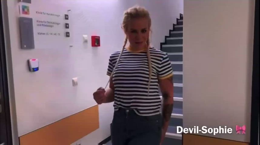 Blonde girl peeing on stairwell